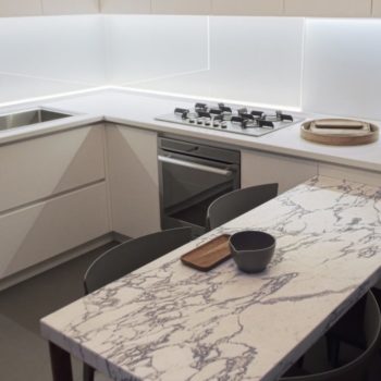 A table top in Arabescato marble and a kitchen top in white Okite were created for this welcoming kitchen environment.
[wp-svg-icons icon="search-2" wrap="h1"]